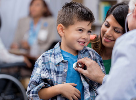 A child with mother and doctor